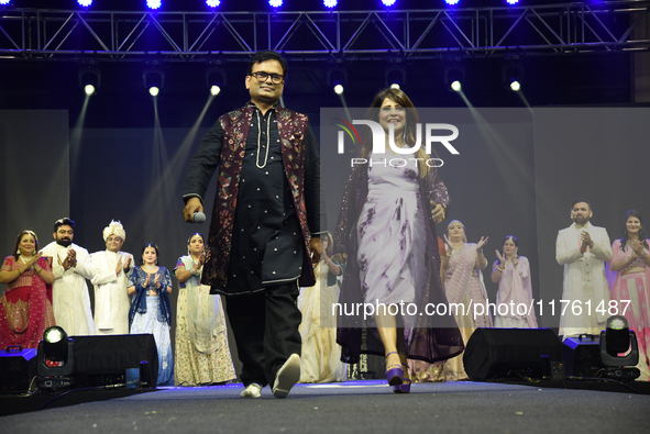 Fashion designers Vandana Gupta and Pankaj Kumar, fashion designer Tejas Gandhi, and model Madhabilata Mitra participate in a fashion show o...