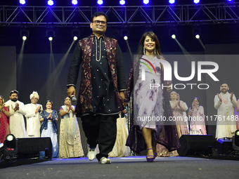 Fashion designers Vandana Gupta and Pankaj Kumar, fashion designer Tejas Gandhi, and model Madhabilata Mitra participate in a fashion show o...