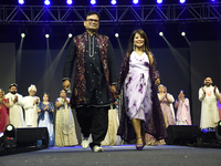 Fashion designers Vandana Gupta and Pankaj Kumar, fashion designer Tejas Gandhi, and model Madhabilata Mitra participate in a fashion show o...