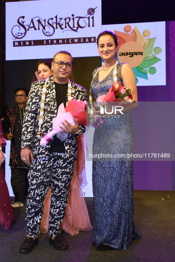 Fashion designer Tejas Gandhi and model Madhabilata Mitra participate in a fashion show organized by Lions International in JW Marriott, Kol...