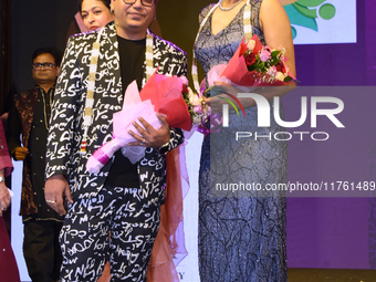 Fashion designer Tejas Gandhi and model Madhabilata Mitra participate in a fashion show organized by Lions International in JW Marriott, Kol...