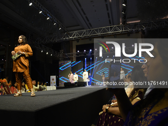 A city industrialist in Indian traditional dress walks the runway during a fashion show organized by Lions International at JW Marriott in K...