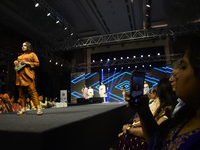 A city industrialist in Indian traditional dress walks the runway during a fashion show organized by Lions International at JW Marriott in K...