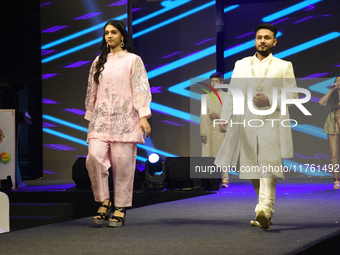 A city industrialist in Indian traditional dress walks the runway during a fashion show organized by Lions International at JW Marriott in K...