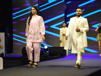 A city industrialist in Indian traditional dress walks the runway during a fashion show organized by Lions International at JW Marriott in K...