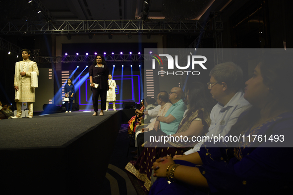 A city industrialist in Indian traditional dress walks the runway during a fashion show organized by Lions International at JW Marriott in K...