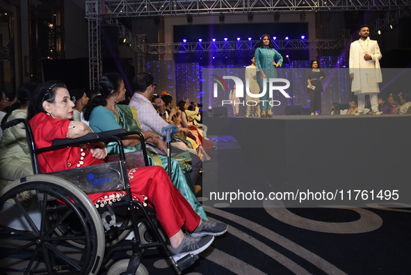 A city industrialist in Indian traditional dress walks the runway during a fashion show organized by Lions International at JW Marriott in K...