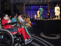 A city industrialist in Indian traditional dress walks the runway during a fashion show organized by Lions International at JW Marriott in K...