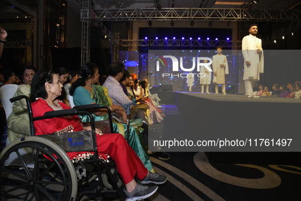 A city industrialist in Indian traditional dress walks the runway during a fashion show organized by Lions International at JW Marriott in K...