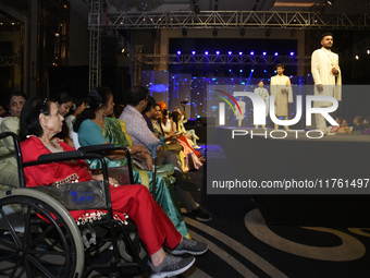 A city industrialist in Indian traditional dress walks the runway during a fashion show organized by Lions International at JW Marriott in K...