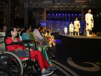 A city industrialist in Indian traditional dress walks the runway during a fashion show organized by Lions International at JW Marriott in K...