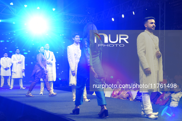 A city industrialist in Indian traditional dress walks the runway during a fashion show organized by Lions International at JW Marriott in K...