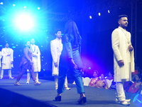 A city industrialist in Indian traditional dress walks the runway during a fashion show organized by Lions International at JW Marriott in K...