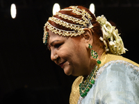 A city industrialist participates in a fashion show featuring Indian traditional jewelry organized by Lions International at JW Marriott in...