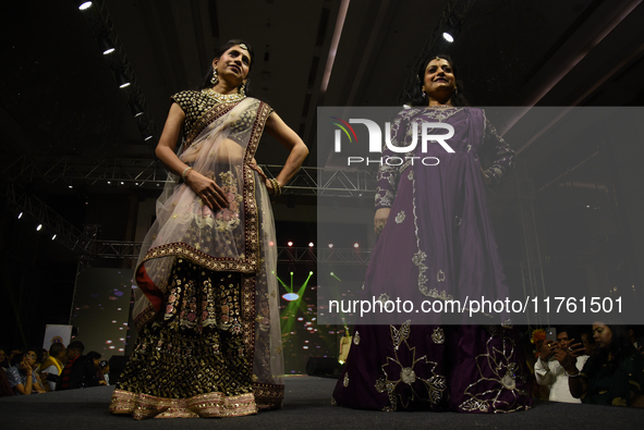 A city industrialist in Indian traditional dress walks the runway during a fashion show organized by Lions International at JW Marriott in K...