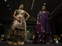 A city industrialist in Indian traditional dress walks the runway during a fashion show organized by Lions International at JW Marriott in K...