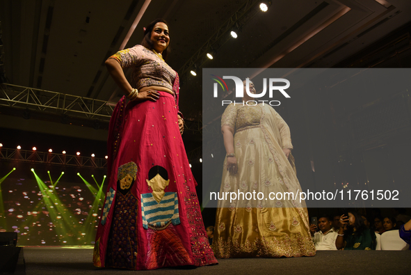 A city industrialist in Indian traditional dress walks the runway during a fashion show organized by Lions International at JW Marriott in K...