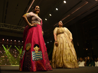 A city industrialist in Indian traditional dress walks the runway during a fashion show organized by Lions International at JW Marriott in K...