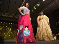 A city industrialist in Indian traditional dress walks the runway during a fashion show organized by Lions International at JW Marriott in K...