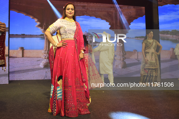 A city industrialist in Indian traditional dress walks the runway during a fashion show organized by Lions International at JW Marriott in K...