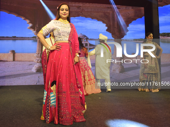 A city industrialist in Indian traditional dress walks the runway during a fashion show organized by Lions International at JW Marriott in K...