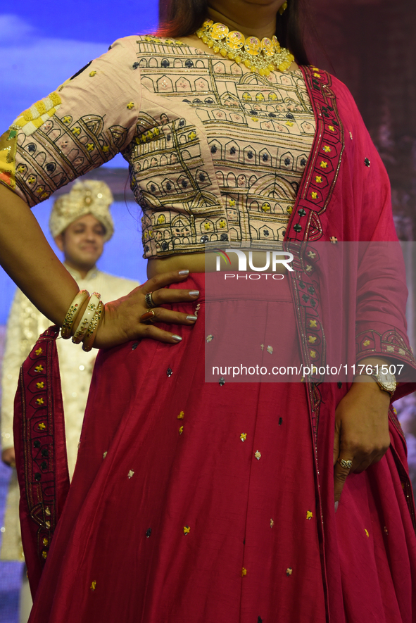 A city industrialist in Indian traditional dress walks the runway during a fashion show organized by Lions International at JW Marriott in K...