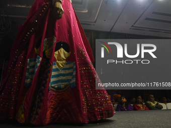 A city industrialist in Indian traditional dress walks the runway during a fashion show organized by Lions International at JW Marriott in K...