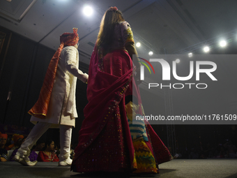 A city industrialist in Indian traditional dress walks the runway during a fashion show organized by Lions International at JW Marriott in K...