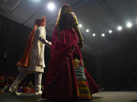 A city industrialist in Indian traditional dress walks the runway during a fashion show organized by Lions International at JW Marriott in K...