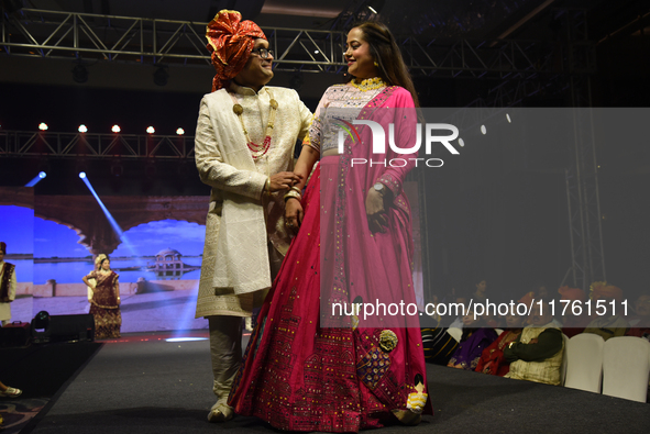 A city industrialist in Indian traditional dress walks the runway during a fashion show organized by Lions International at JW Marriott in K...