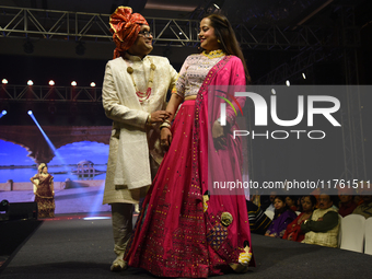 A city industrialist in Indian traditional dress walks the runway during a fashion show organized by Lions International at JW Marriott in K...