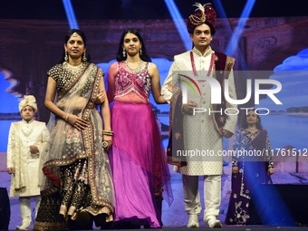 A city industrialist in Indian traditional dress walks the runway during a fashion show organized by Lions International at JW Marriott in K...