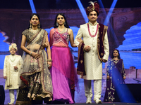 A city industrialist in Indian traditional dress walks the runway during a fashion show organized by Lions International at JW Marriott in K...