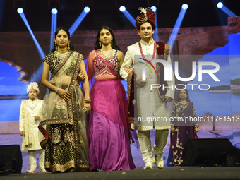 A city industrialist in Indian traditional dress walks the runway during a fashion show organized by Lions International at JW Marriott in K...