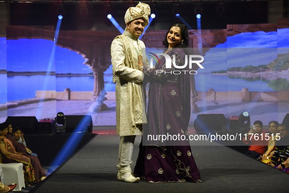 A city industrialist in Indian traditional dress walks the runway during a fashion show organized by Lions International at JW Marriott in K...