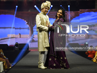 A city industrialist in Indian traditional dress walks the runway during a fashion show organized by Lions International at JW Marriott in K...