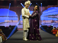 A city industrialist in Indian traditional dress walks the runway during a fashion show organized by Lions International at JW Marriott in K...