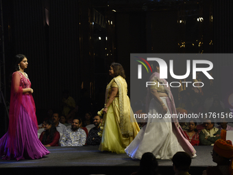 A city industrialist in Indian traditional dress walks the runway during a fashion show organized by Lions International at JW Marriott in K...