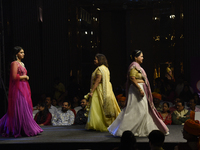 A city industrialist in Indian traditional dress walks the runway during a fashion show organized by Lions International at JW Marriott in K...