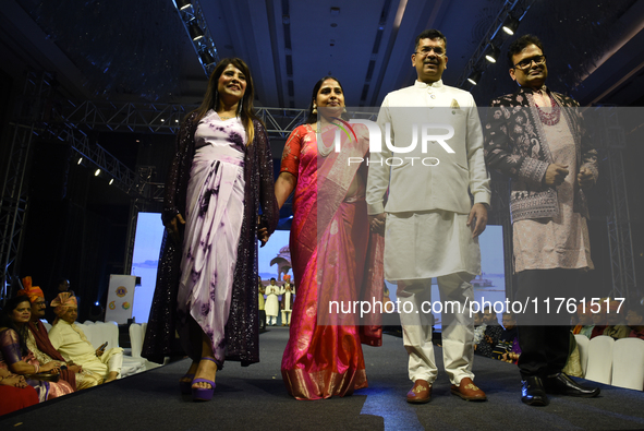 A city industrialist in Indian traditional dress walks the runway during a fashion show organized by Lions International at JW Marriott in K...