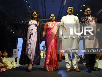 A city industrialist in Indian traditional dress walks the runway during a fashion show organized by Lions International at JW Marriott in K...