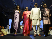 A city industrialist in Indian traditional dress walks the runway during a fashion show organized by Lions International at JW Marriott in K...