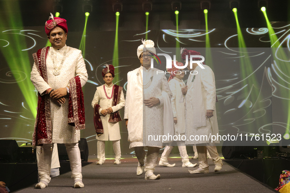 A city industrialist in Indian traditional dress walks the runway during a fashion show organized by Lions International at JW Marriott in K...