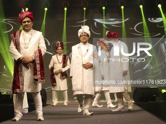 A city industrialist in Indian traditional dress walks the runway during a fashion show organized by Lions International at JW Marriott in K...