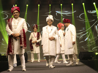 A city industrialist in Indian traditional dress walks the runway during a fashion show organized by Lions International at JW Marriott in K...