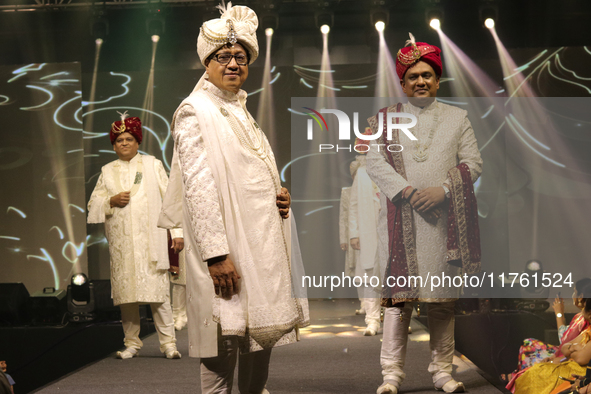 A city industrialist in Indian traditional dress walks the runway during a fashion show organized by Lions International at JW Marriott in K...