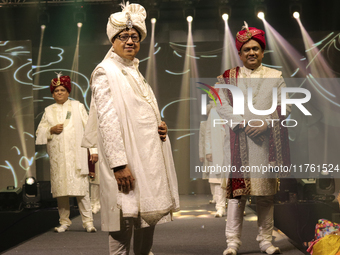 A city industrialist in Indian traditional dress walks the runway during a fashion show organized by Lions International at JW Marriott in K...