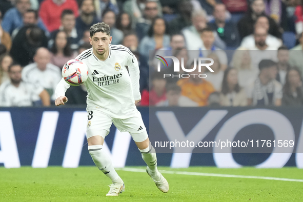 Federico Valverde central midfield of Real Madrid and Uruguay controls the ball during the La Liga match between Real Madrid CF and CA Osasu...