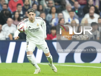 Federico Valverde central midfield of Real Madrid and Uruguay controls the ball during the La Liga match between Real Madrid CF and CA Osasu...