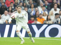 Federico Valverde central midfield of Real Madrid and Uruguay controls the ball during the La Liga match between Real Madrid CF and CA Osasu...